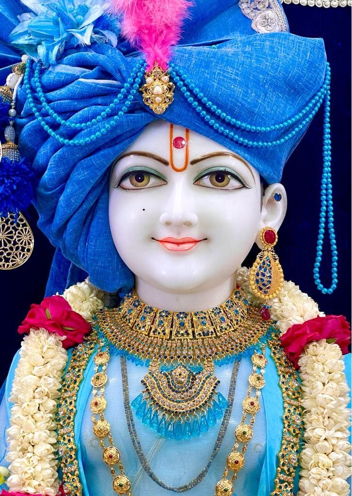 Swaminarayan idol with jeweled mukut.