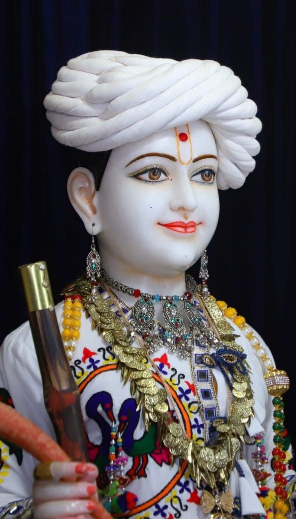 Swaminarayan idol with ornate jewelry