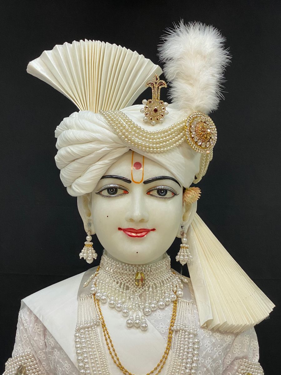 Close-up of Swaminarayan in pearl mukut