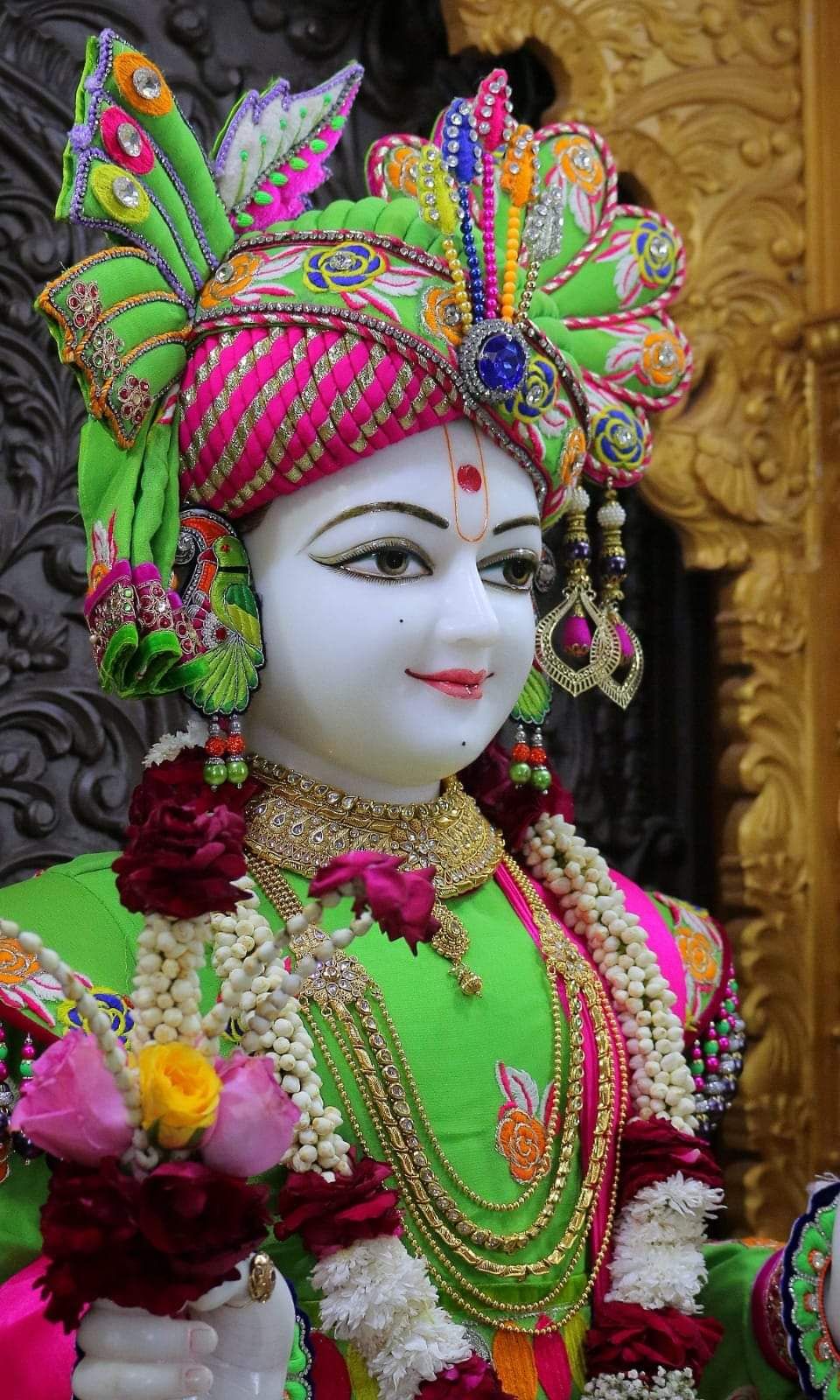 Swaminarayan with ornate floral headgear