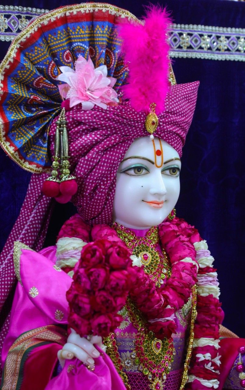 Swaminarayan with pink floral garland