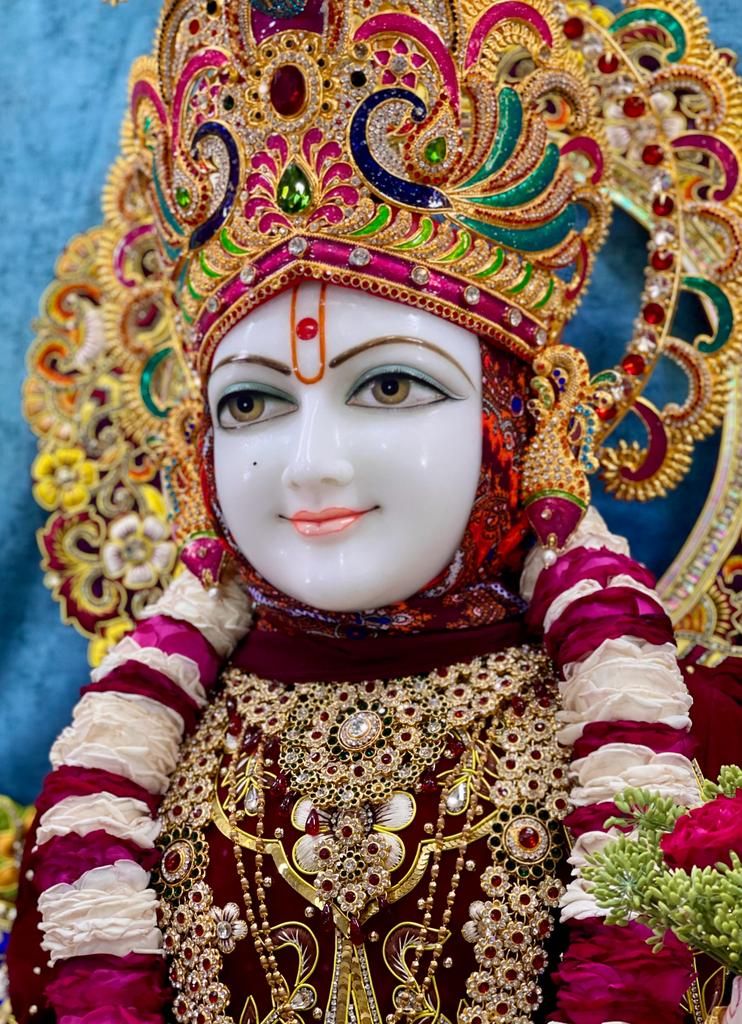 Close-up of serene Swaminarayan deity
