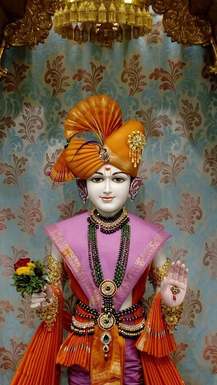 Swaminarayan murti with orange turban