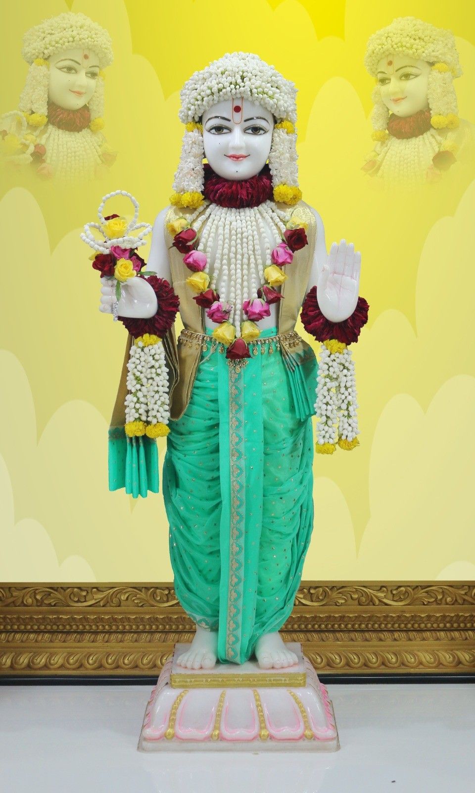 Swaminarayan deity adorned with flowers