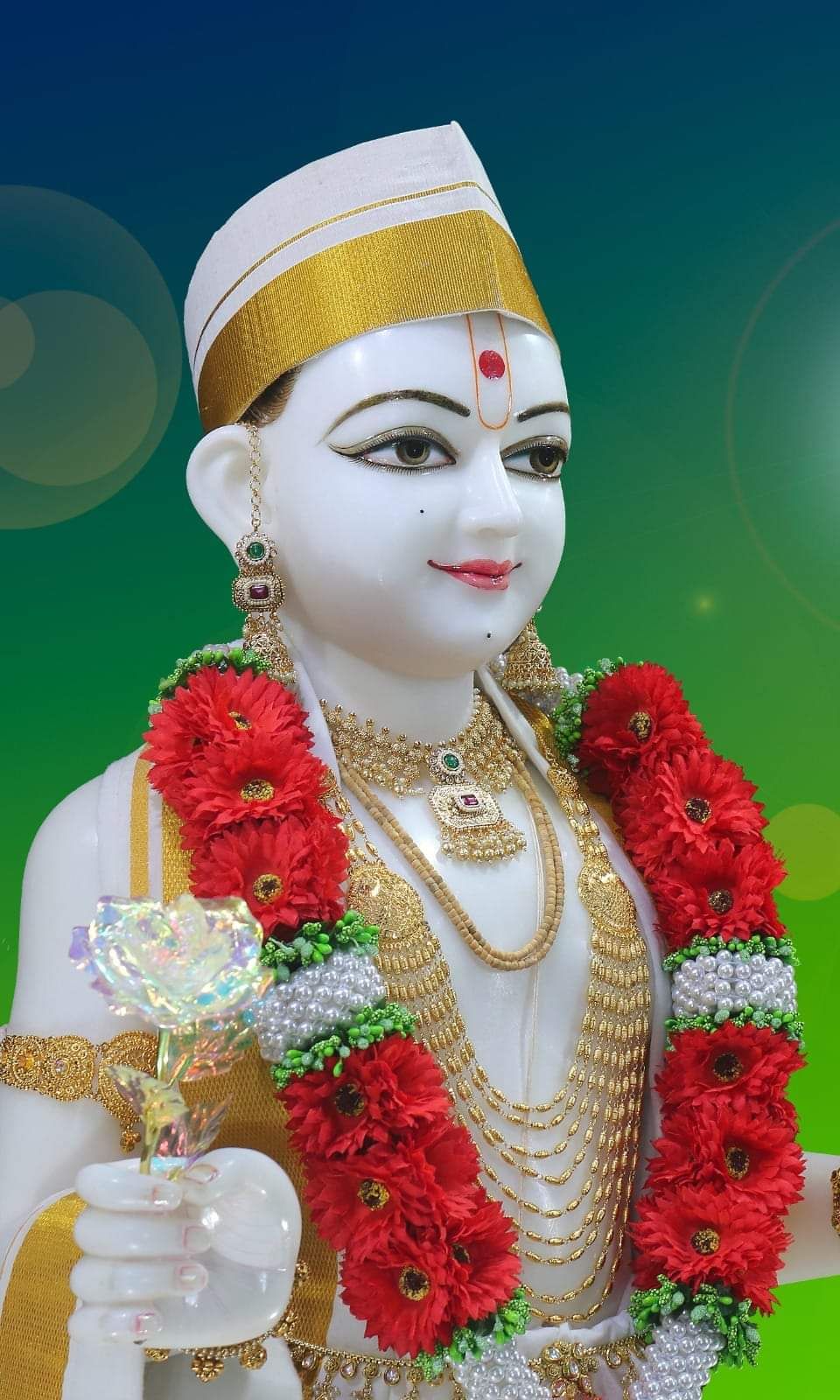 Swaminarayan with red flower garland