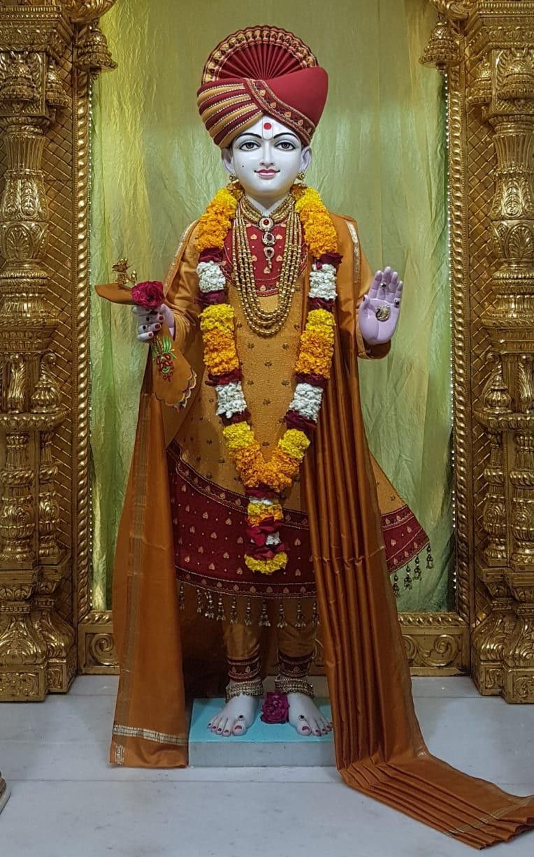 Swaminarayan Bhagwan\'s serene temple statue.