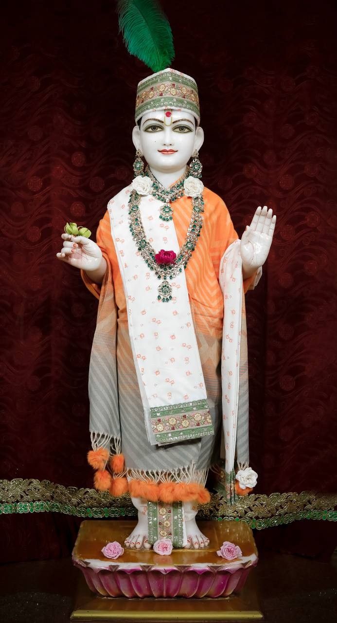 Swaminarayan deity statue blessing devotees