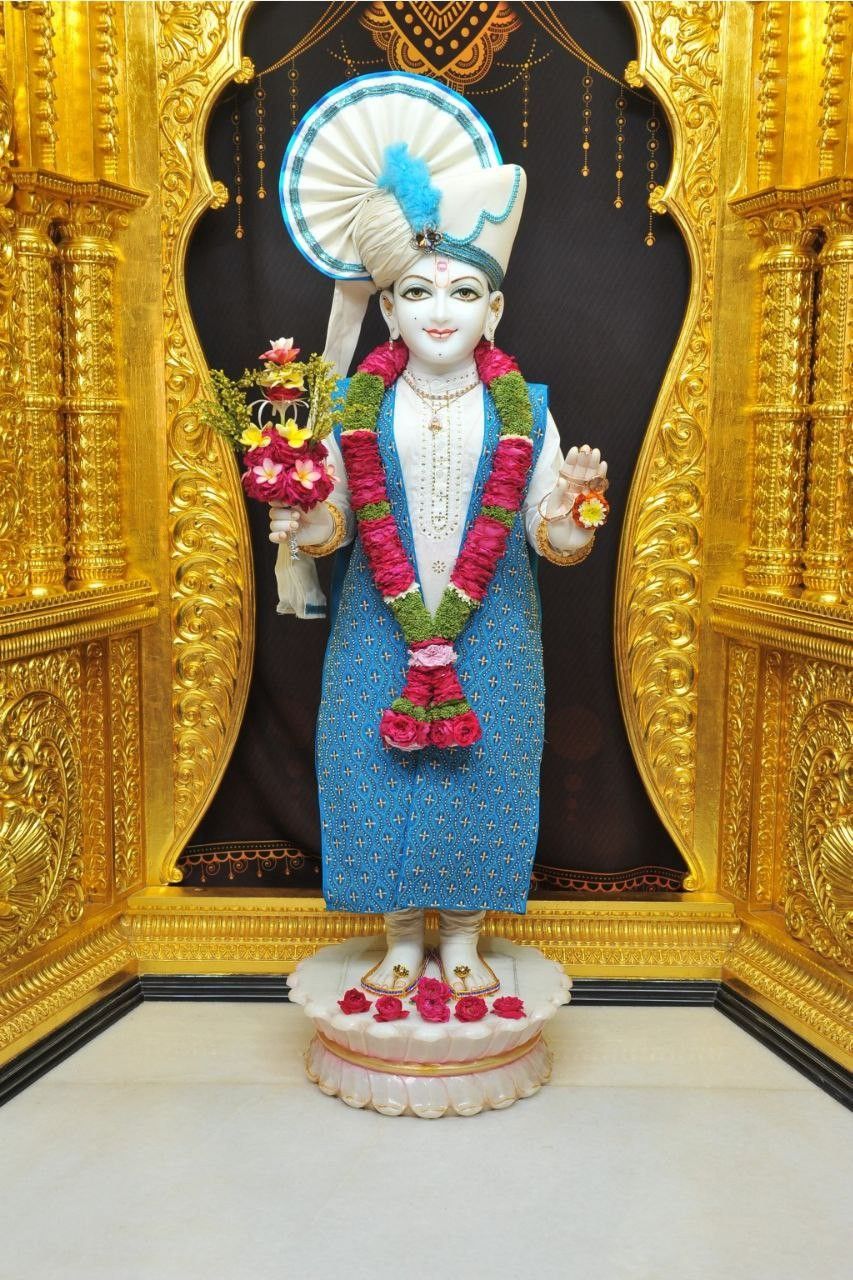 Swaminarayan idol with floral decorations