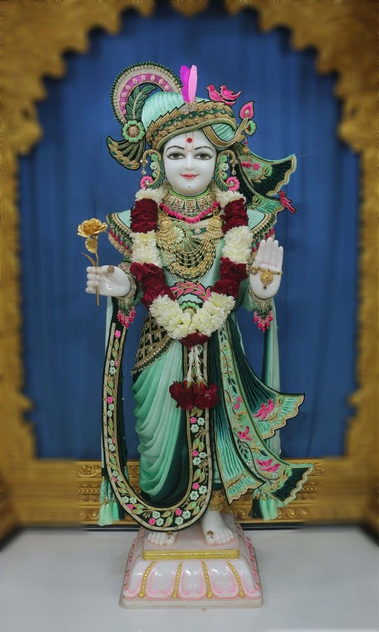 Swaminarayan idol adorned with flowers