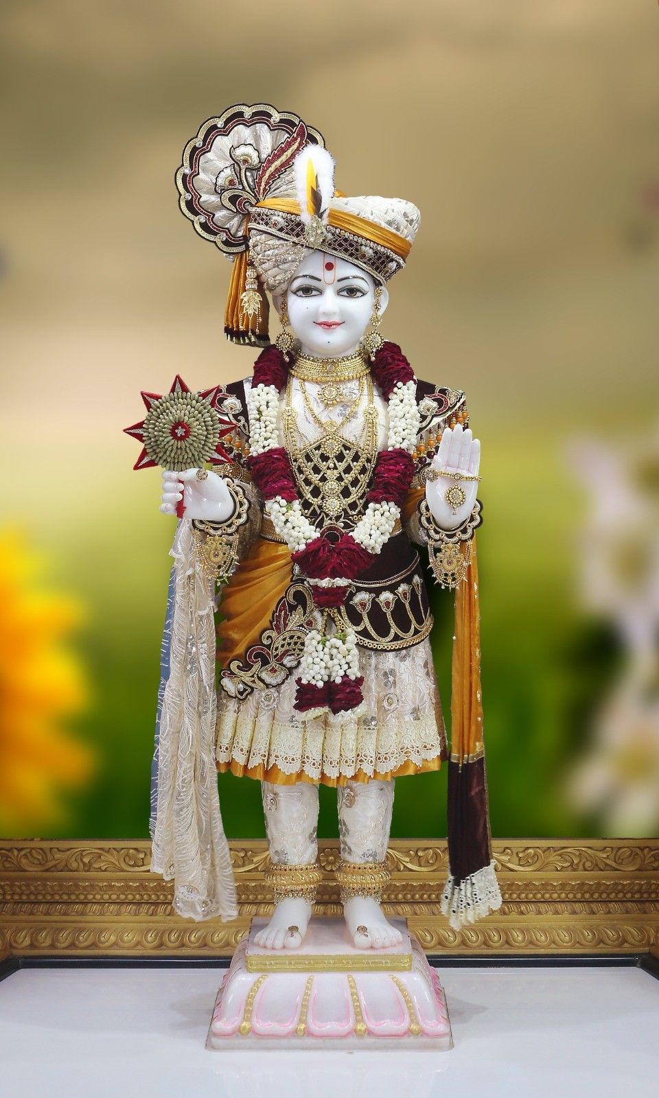 Swaminarayan Bhagwan in regal golden attire