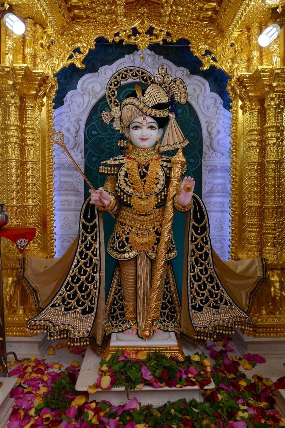 Swaminarayan statue in ornate temple setting