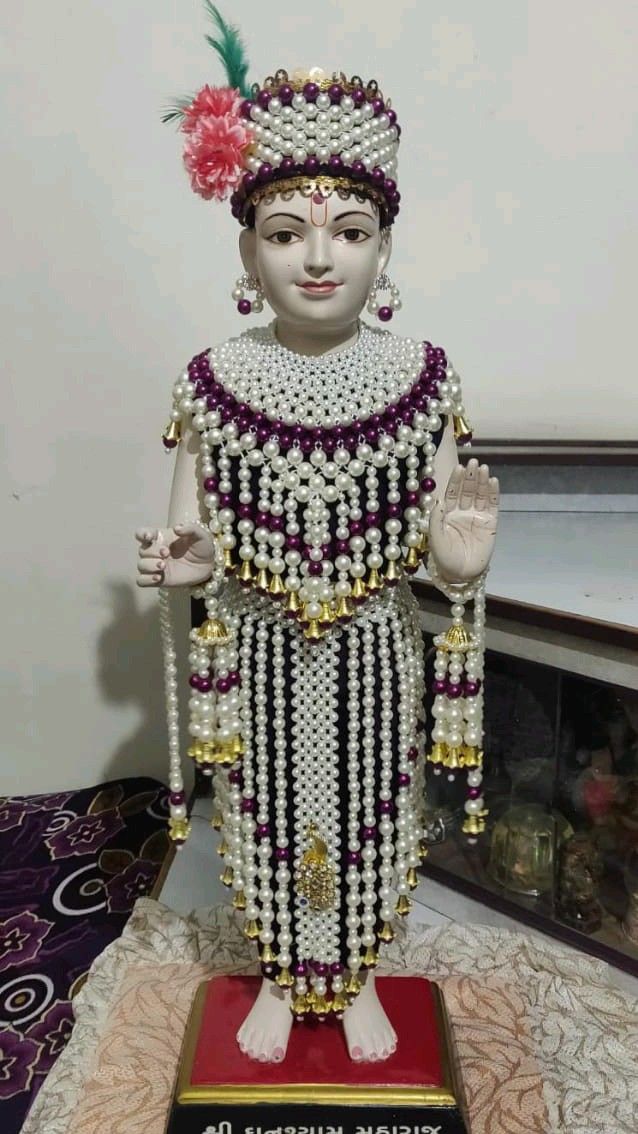Swaminarayan deity adorned with pearls