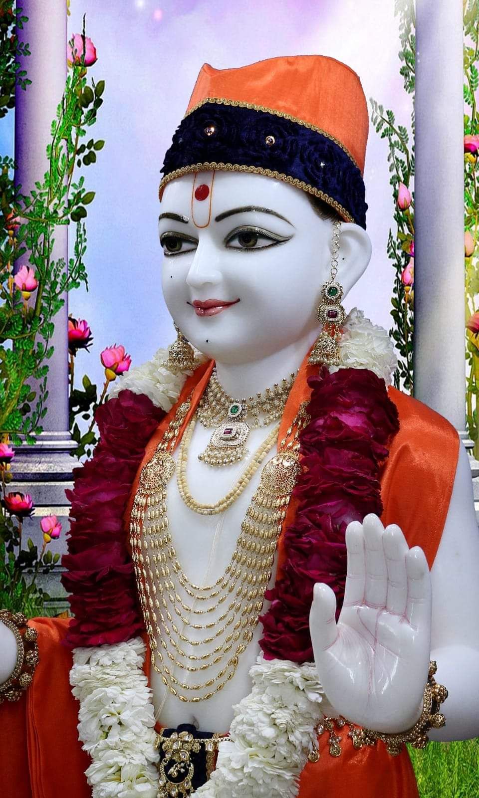 Divine Swaminarayan statue offering blessings.