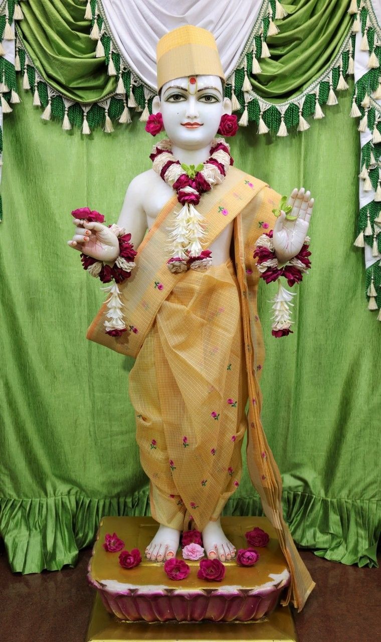 Swaminarayan Bhagwan with floral garlands