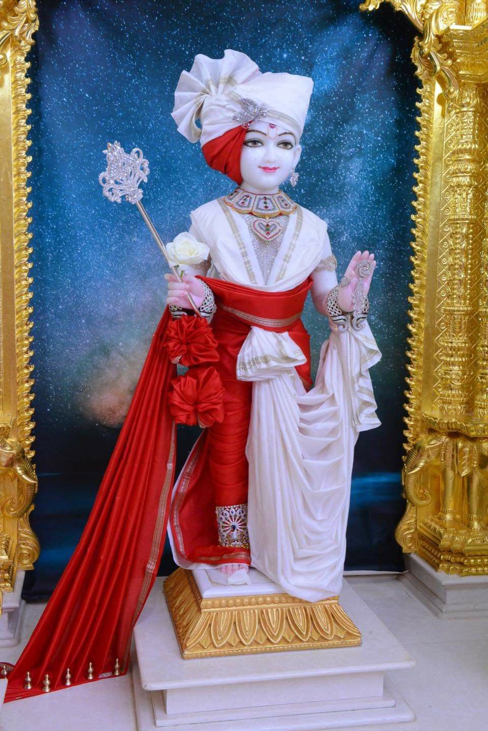 Swaminarayan statue in a temple setting