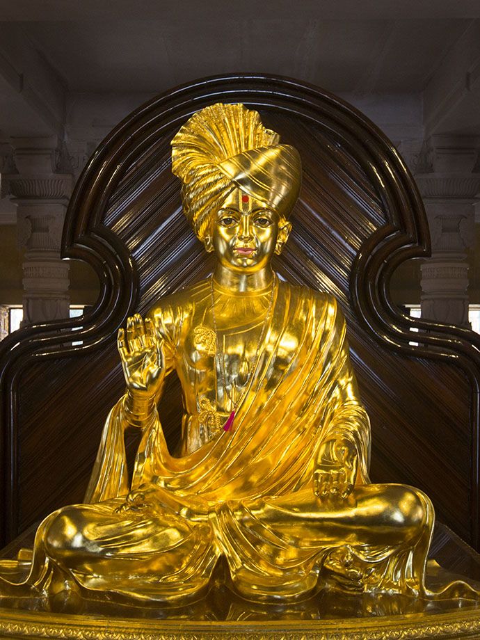 Golden Swaminarayan statue in temple
