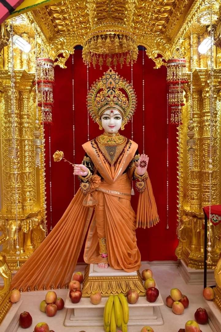 Swaminarayan statue with rose offering