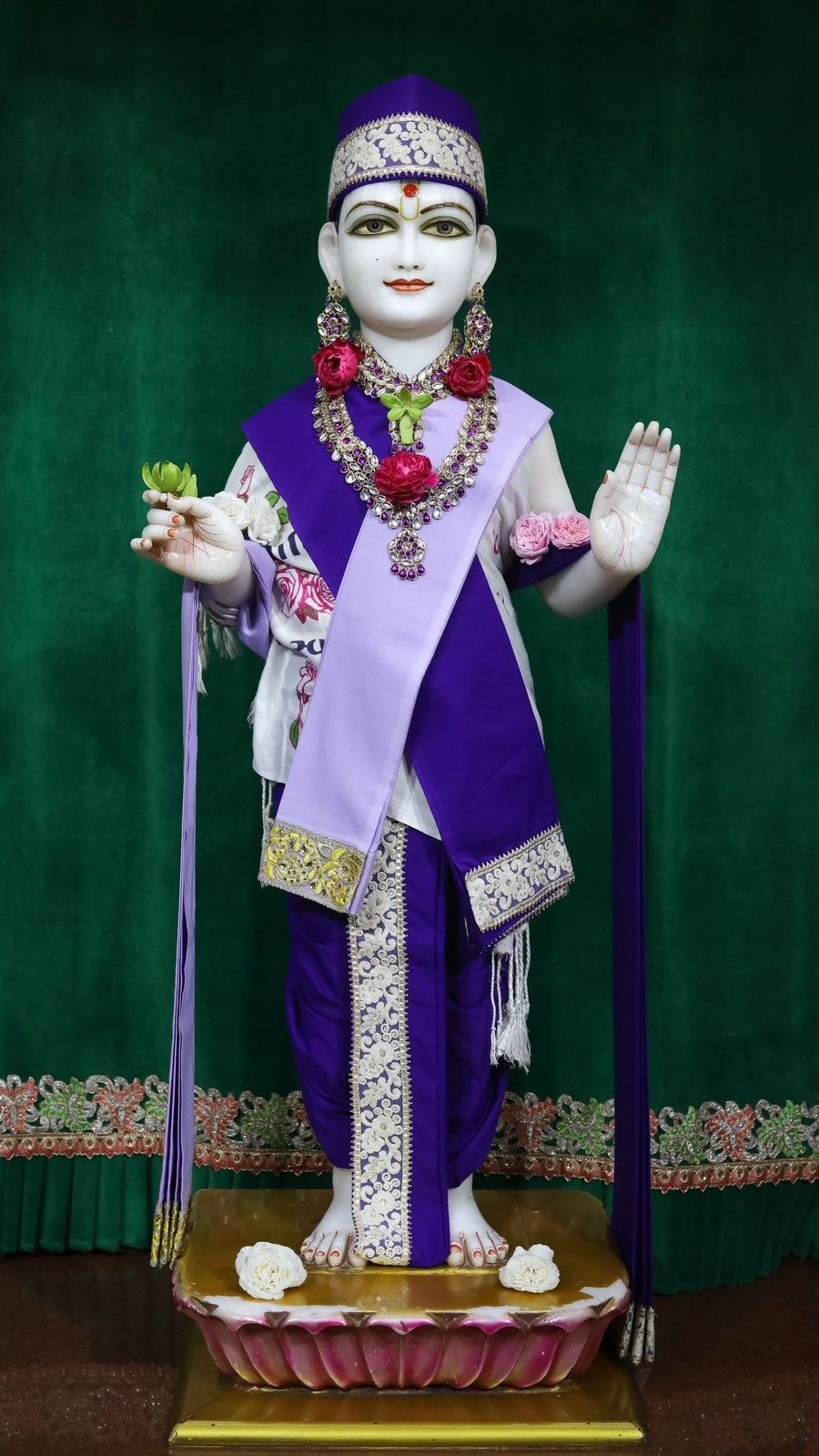 Swaminarayan Ji statue in purple attire