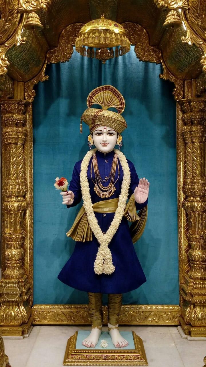 Swaminarayan murti in ornate temple setting