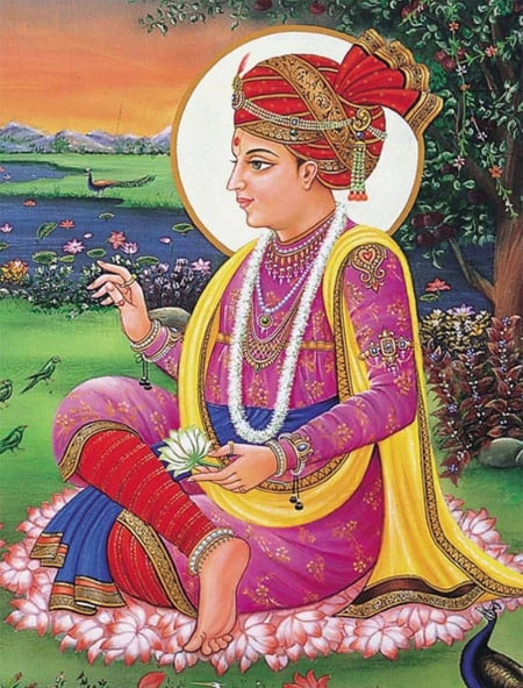 Swaminarayan holding a lotus flower.