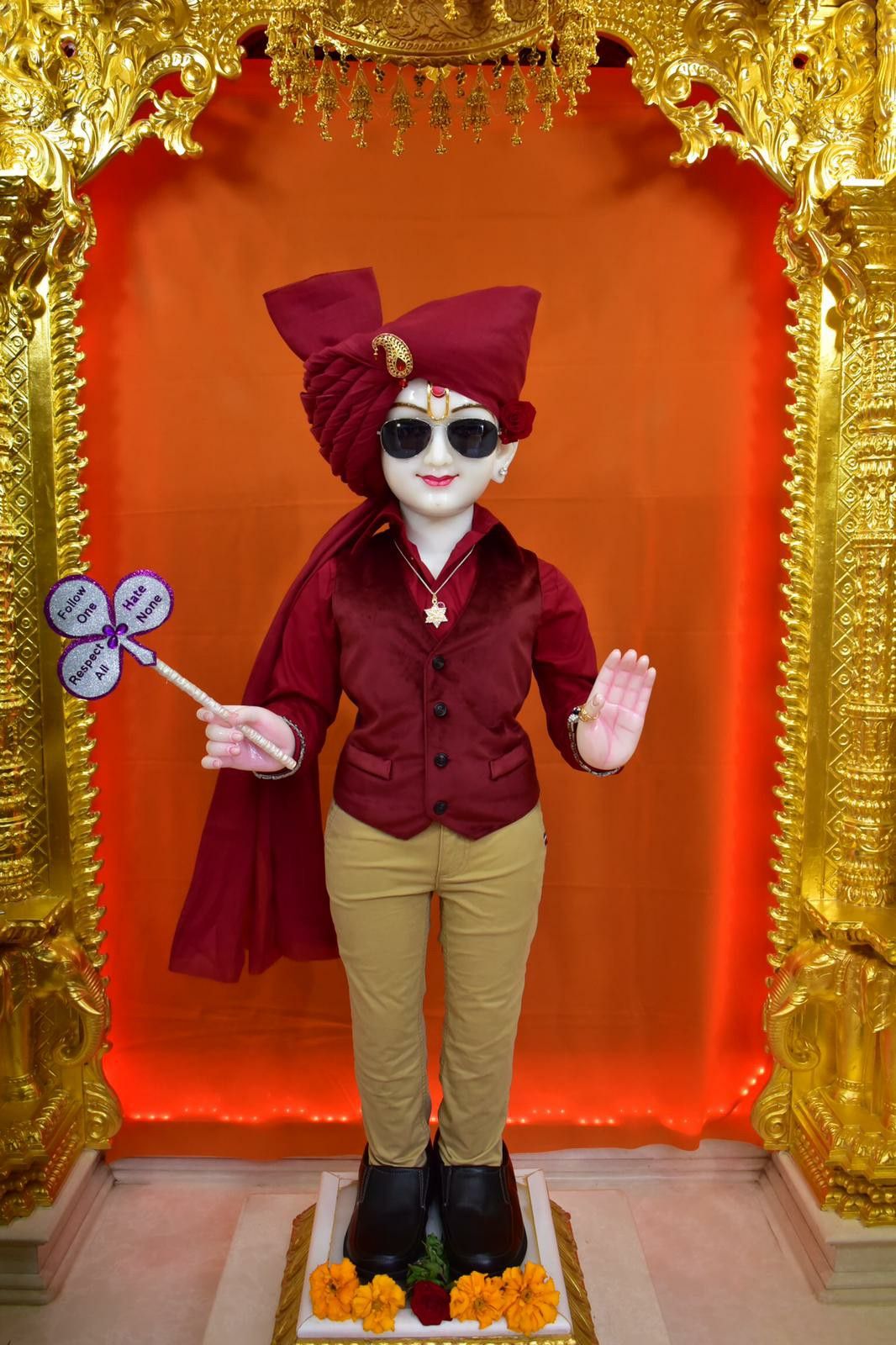 Swaminarayan statue with sunglasses and turban