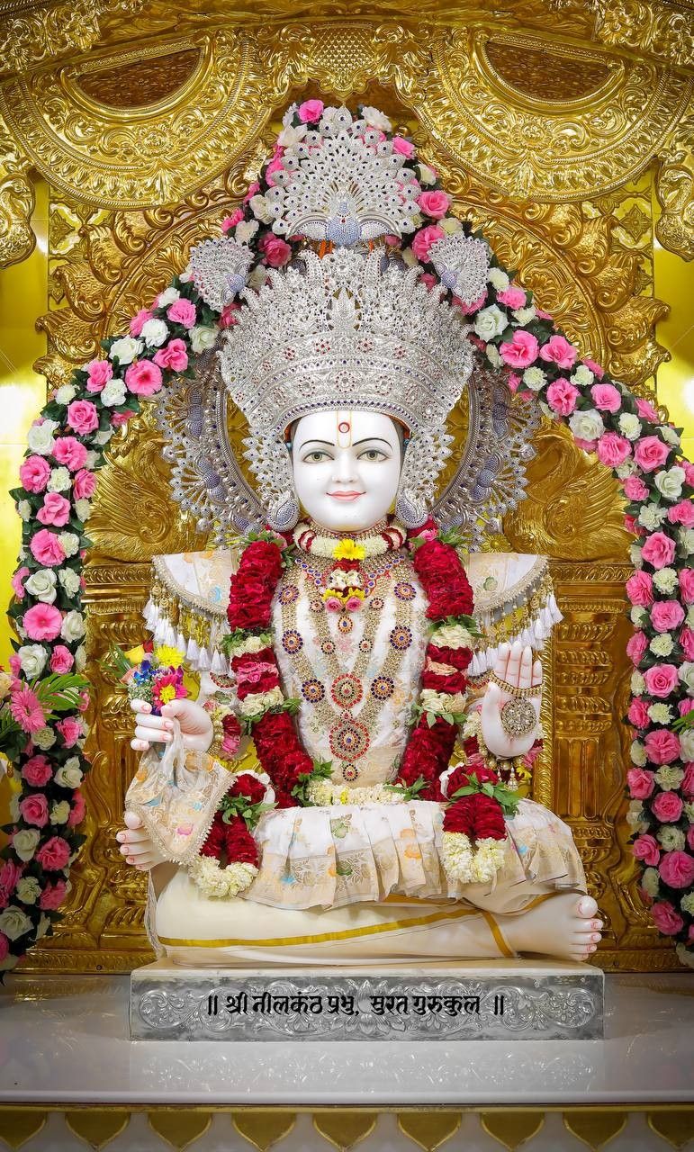 Swaminarayan deity with floral offerings