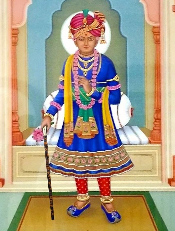Swaminarayan in royal attire, blessing pose.