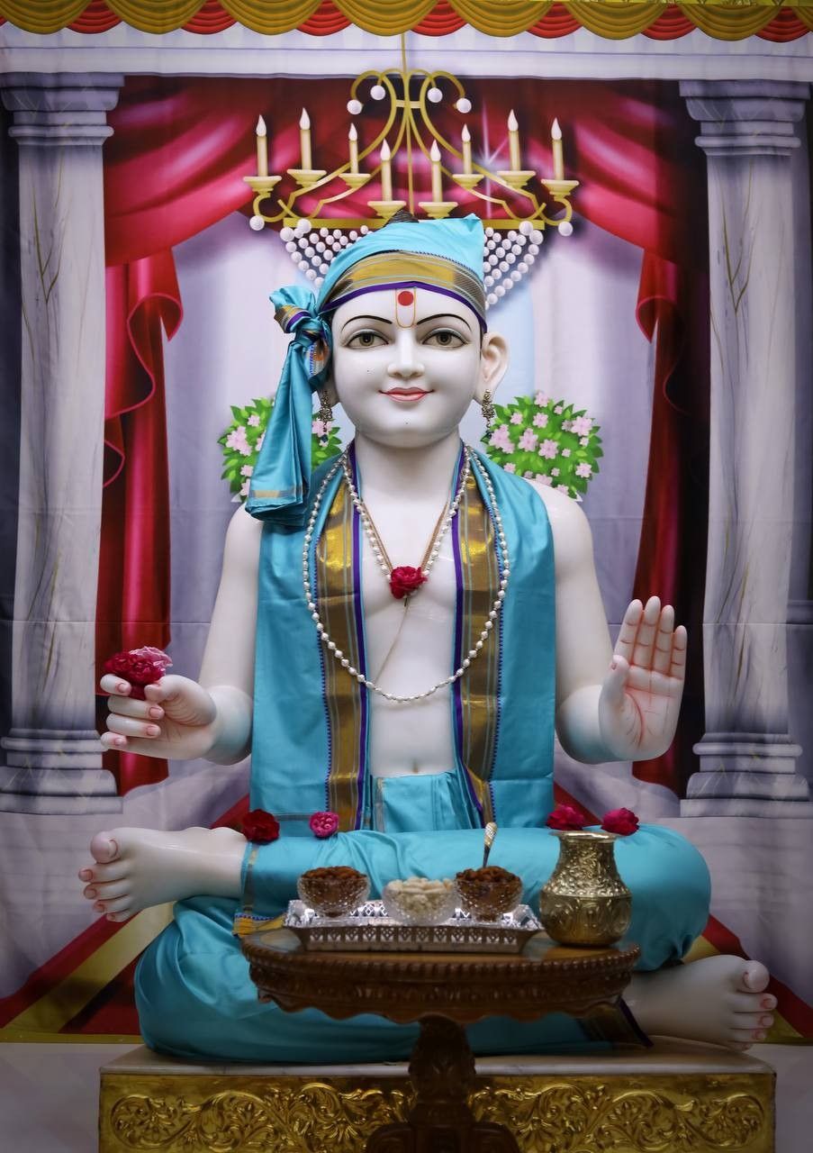 Swaminarayan statue in a temple setting