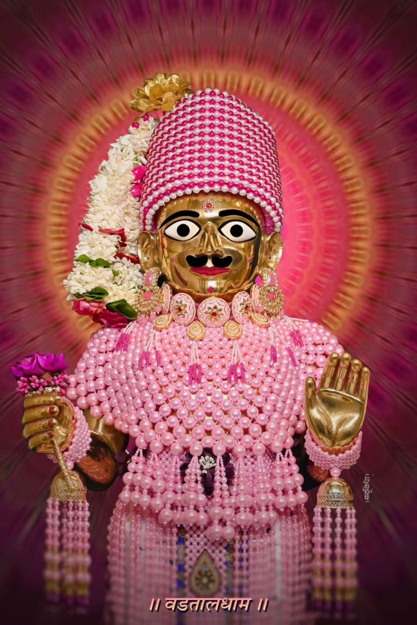 Swaminarayan Bhagwan adorned with pink flowers